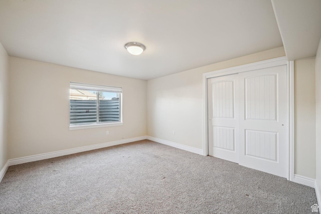 664 E Oak Wood Dr N Unit 50, Heber City, UT 84032 - unfurnished bedroom featuring a closet, baseboards, and carpet floors