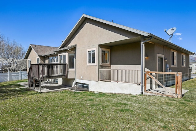 664 E Oak Wood Dr N Unit 50, Heber City, UT 84032 - rear view of house with a yard, fence, a patio area, and stucco siding