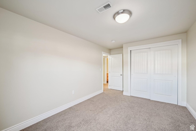 664 E Oak Wood Dr N Unit 50, Heber City, UT 84032 - unfurnished bedroom featuring a closet, carpet, visible vents, and baseboards
