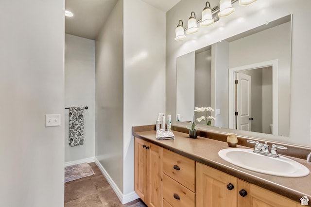 546 S Quirk St, Grantsville, UT 84029 - bathroom featuring baseboards, toilet, and vanity