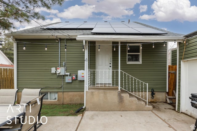 2209 Van Buren Ave, Ogden, UT 84401 - exterior space featuring a shingled roof, fence, and solar panels
