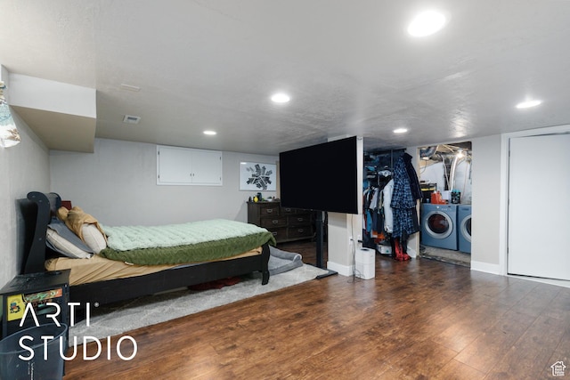 2209 Van Buren Ave, Ogden, UT 84401 - bedroom with visible vents, wood finished floors, recessed lighting, and washer and clothes dryer
