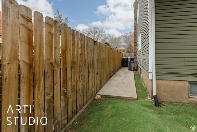 2209 Van Buren Ave, Ogden, UT 84401 - view of yard featuring central air condition unit and fence