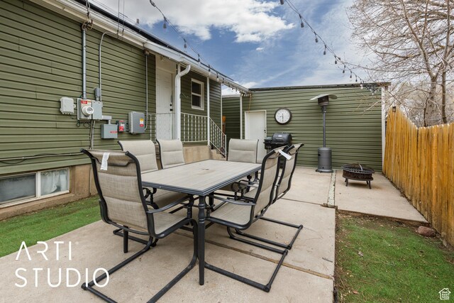 2209 Van Buren Ave, Ogden, UT 84401 - view of patio / terrace featuring an outdoor fire pit, outdoor dining space, and fence