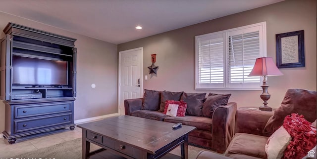 living area with light tile patterned floors and recessed lighting