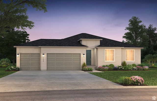 ranch-style home with driveway and a garage
