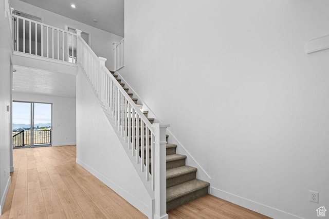 3666 W 2110 S Unit 103, Syracuse, UT 84075 - stairs with baseboards and wood finished floors