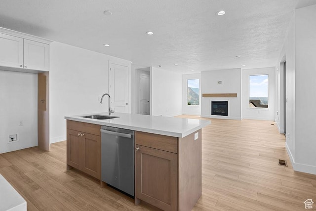 3666 W 2110 S Unit 103, Syracuse, UT 84075 - kitchen featuring an island with sink, light wood-style flooring, a sink, and dishwasher
