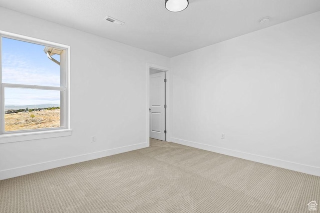3666 W 2110 S Unit 103, Syracuse, UT 84075 - empty room with light carpet, baseboards, and visible vents