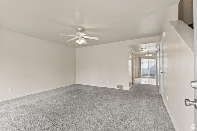 1762 N 460 W Unit 103-10, Logan, UT 84341 - empty room featuring visible vents, ceiling fan, carpet flooring, and baseboards