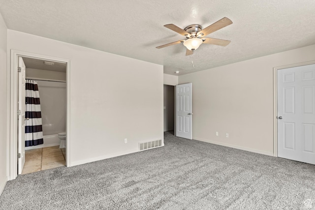 1762 N 460 W Unit 103-10, Logan, UT 84341 - unfurnished bedroom featuring visible vents, baseboards, carpet floors, and a textured ceiling