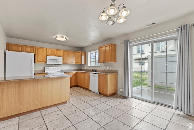 1762 N 460 W Unit 103-10, Logan, UT 84341 - kitchen with a chandelier, white appliances, light tile patterned floors, visible vents, and a sink