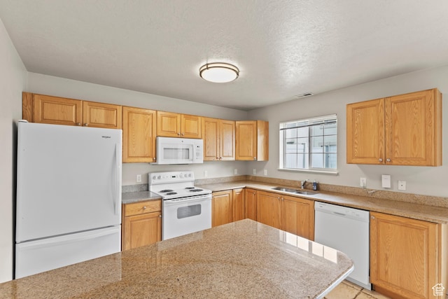 1762 N 460 W Unit 103-10, Logan, UT 84341 - kitchen featuring white appliances, light countertops, a textured ceiling, visible vents, and a sink