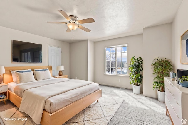 1762 N 460 W Unit 103-10, Logan, UT 84341 - bedroom featuring baseboards, a ceiling fan, and light colored carpet