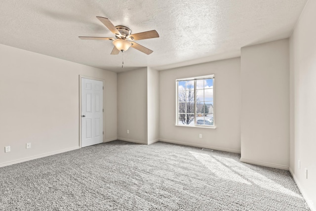 1762 N 460 W Unit 103-10, Logan, UT 84341 - carpeted spare room with baseboards, a textured ceiling, and a ceiling fan