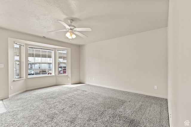 1762 N 460 W Unit 103-10, Logan, UT 84341 - carpeted spare room featuring a textured ceiling, baseboards, and a ceiling fan