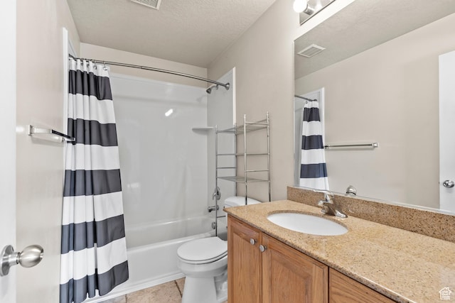 1762 N 460 W Unit 103-10, Logan, UT 84341 - bathroom with visible vents, shower / bath combination with curtain, toilet, vanity, and tile patterned flooring