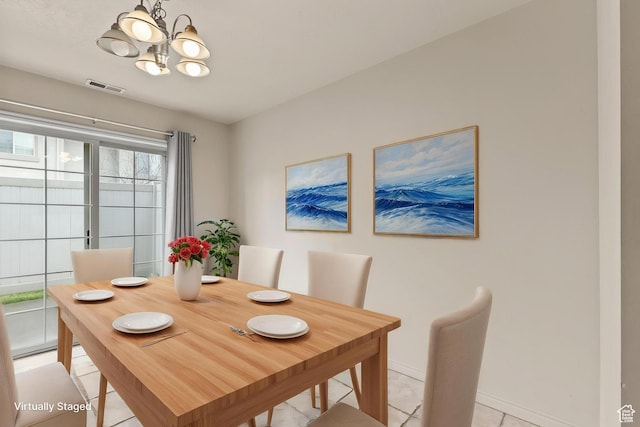1762 N 460 W Unit 103-10, Logan, UT 84341 - dining space featuring visible vents, baseboards, an inviting chandelier, and light tile patterned floors