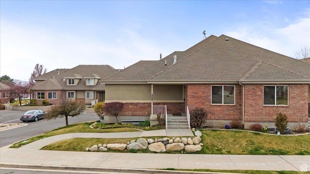 9587 N 4500 W, Cedar Hills, UT 84062 - view of front of home with a front lawn and brick siding