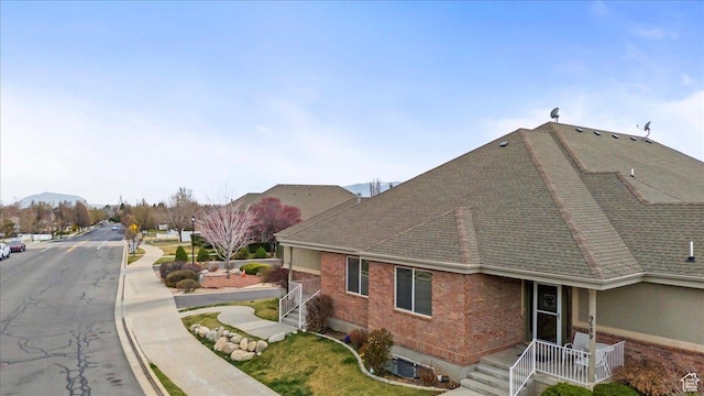 9587 N 4500 W, Cedar Hills, UT 84062 - exterior space featuring a shingled roof, central AC, and brick siding
