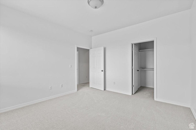 9587 N 4500 W, Cedar Hills, UT 84062 - unfurnished bedroom featuring light carpet, baseboards, and a walk in closet