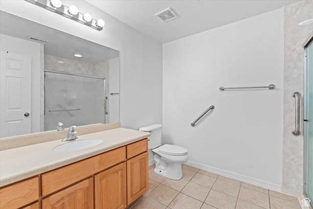 9587 N 4500 W, Cedar Hills, UT 84062 - bathroom with visible vents, toilet, vanity, a stall shower, and tile patterned flooring