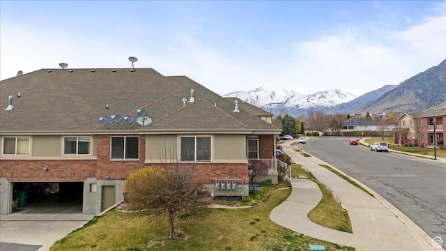 9587 N 4500 W, Cedar Hills, UT 84062 - exterior space featuring a garage, brick siding, roof with shingles, driveway, and a mountain view