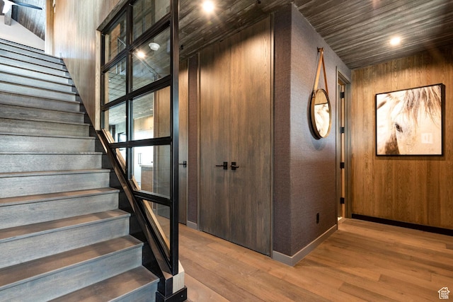 7457 E Stardust Ct Unit 311B, Heber City, UT 84032 - stairs featuring wood walls, baseboards, and wood finished floors