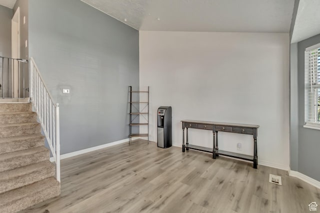 2683 S Melville Dr, Magna, UT 84044 - interior space featuring baseboards, stairway, and wood finished floors