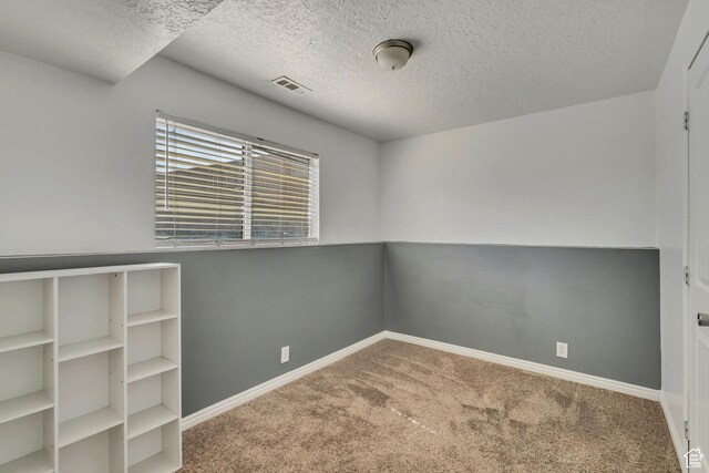 2683 S Melville Dr, Magna, UT 84044 - carpeted empty room with a textured ceiling, visible vents, and baseboards