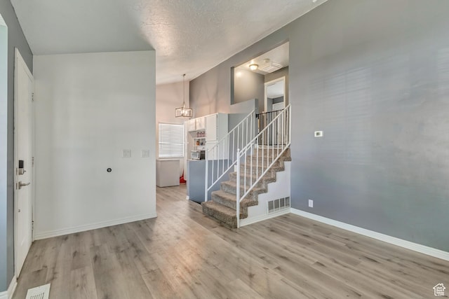 2683 S Melville Dr, Magna, UT 84044 - interior space with visible vents, wood finished floors, baseboards, and stairs