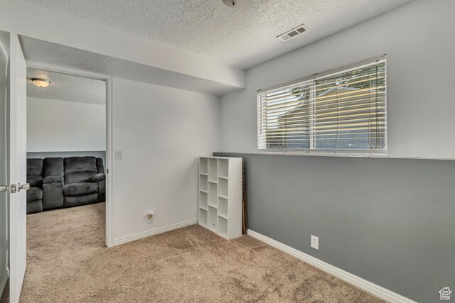 2683 S Melville Dr, Magna, UT 84044 - carpeted empty room featuring a textured ceiling, baseboards, and visible vents