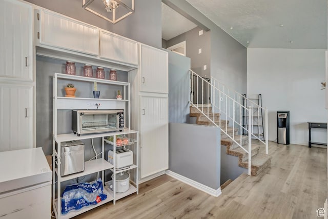 2683 S Melville Dr, Magna, UT 84044 - stairs featuring a toaster and wood finished floors