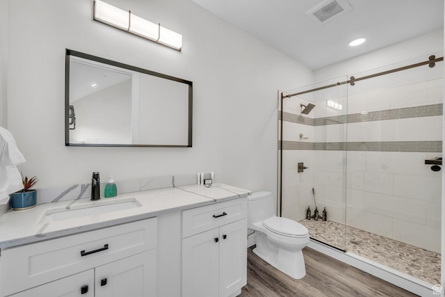 4301 W Canterbury Rd, Hurricane, UT 84737 - full bath with visible vents, toilet, a stall shower, and wood finished floors