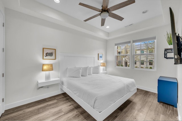 4301 W Canterbury Rd, Hurricane, UT 84737 - bedroom with visible vents, baseboards, wood finished floors, recessed lighting, and a raised ceiling