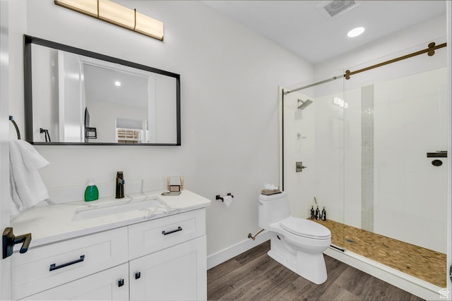 4301 W Canterbury Rd, Hurricane, UT 84737 - full bathroom featuring vanity, toilet, a shower stall, visible vents, and wood finished floors