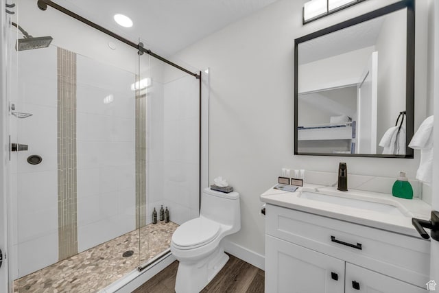 4301 W Canterbury Rd, Hurricane, UT 84737 - bathroom featuring toilet, a stall shower, vanity, and wood finished floors