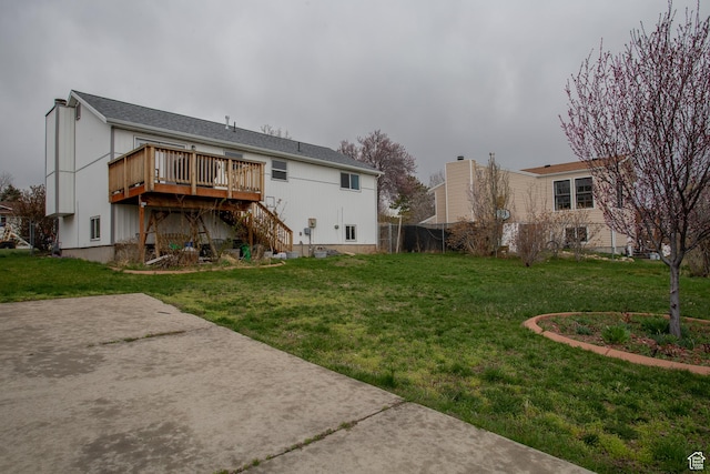 6100 W 3725 S, West Valley City, UT 84128 - back of property with stairs, a wooden deck, and a yard