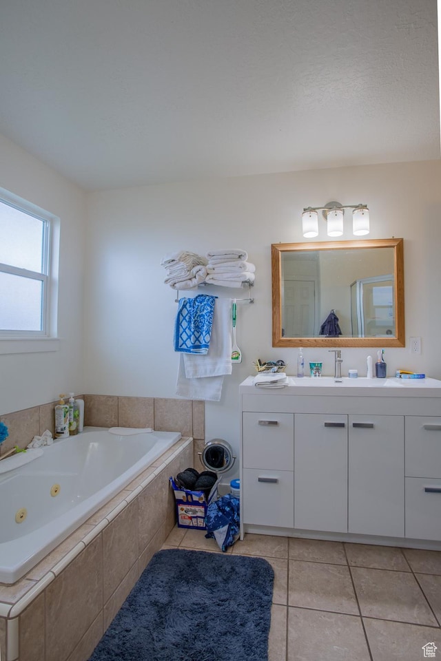 6100 W 3725 S, West Valley City, UT 84128 - full bath featuring vanity, tile patterned flooring, and a jetted tub