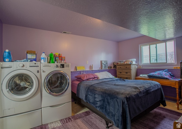 6100 W 3725 S, West Valley City, UT 84128 - tiled bedroom with a textured ceiling, visible vents, and separate washer and dryer