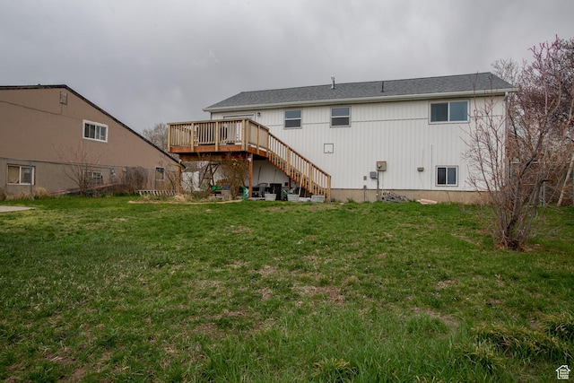 6100 W 3725 S, West Valley City, UT 84128 - back of property with a yard, stairs, and a wooden deck