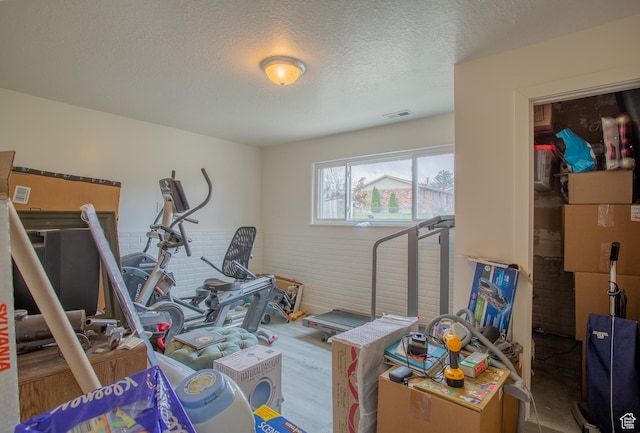 6100 W 3725 S, West Valley City, UT 84128 - exercise area featuring a textured ceiling, visible vents, and wood finished floors