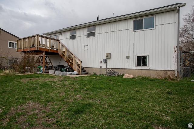 6100 W 3725 S, West Valley City, UT 84128 - rear view of house featuring a lawn, stairs, fence, and a deck