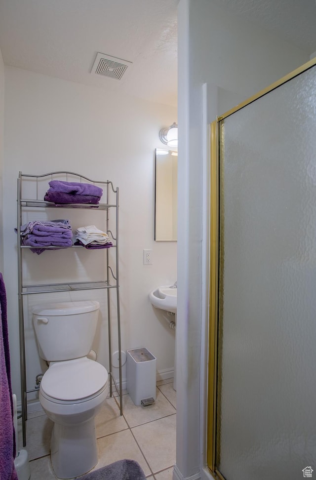 6100 W 3725 S, West Valley City, UT 84128 - bathroom with tile patterned floors, toilet, a stall shower, and visible vents