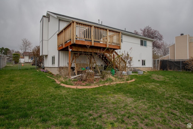 6100 W 3725 S, West Valley City, UT 84128 - back of property with a lawn, a deck, fence, and stairway