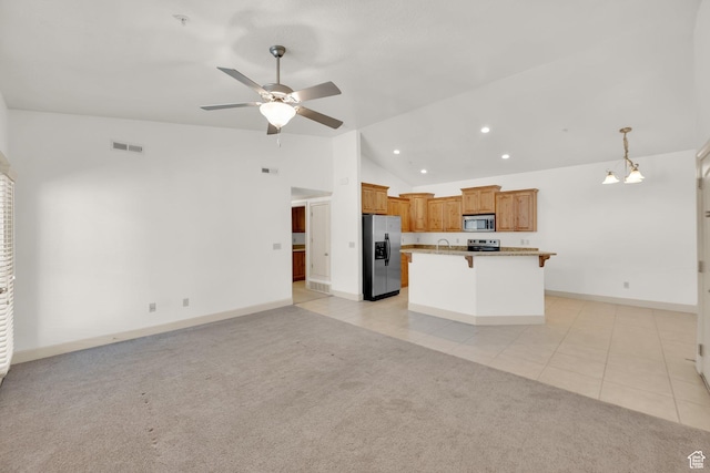 982 W 960 N Unit 116, Orem, UT 84057 - kitchen featuring open floor plan, a ceiling fan, visible vents, lofted ceiling, and appliances with stainless steel finishes