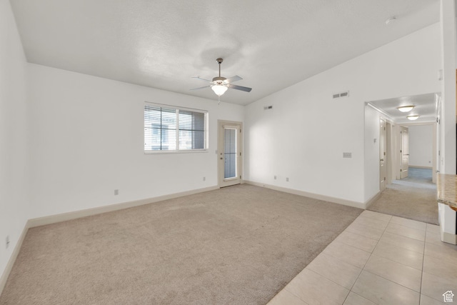 982 W 960 N Unit 116, Orem, UT 84057 - spare room with ceiling fan, light tile patterned floors, visible vents, light carpet, and baseboards