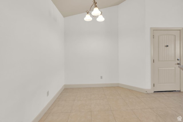 982 W 960 N Unit 116, Orem, UT 84057 - unfurnished room with baseboards, a chandelier, lofted ceiling, and light tile patterned flooring
