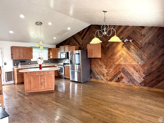 kitchen featuring open shelves, appliances with stainless steel finishes, light countertops, wood walls, and vaulted ceiling