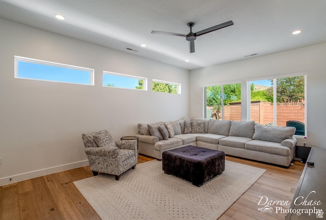 3169 S Pecos Dr, Washington, UT 84780 - living room featuring a ceiling fan, plenty of natural light, light wood finished floors, and visible vents